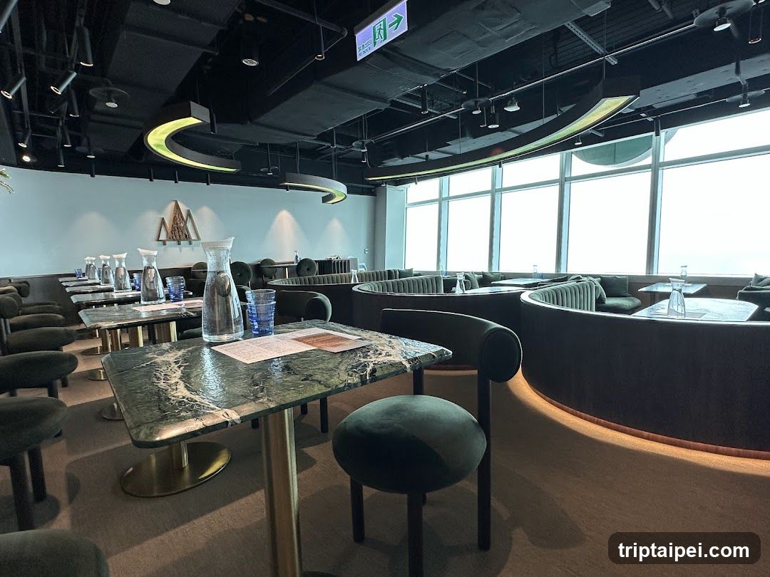 Modern Interior Space with Marble Tables and Green Seating