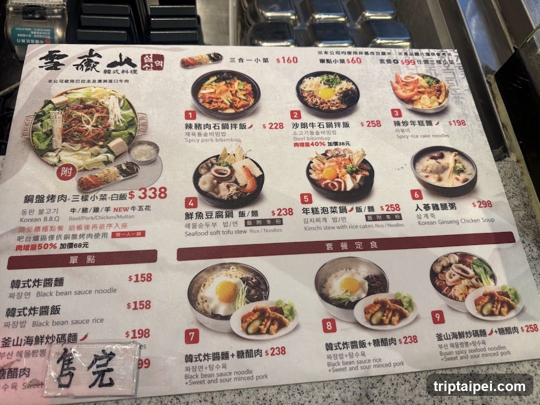 A printed menu from a Chinese restaurant featuring various noodle dishes, rice bowls, and soups with prices in HKD.