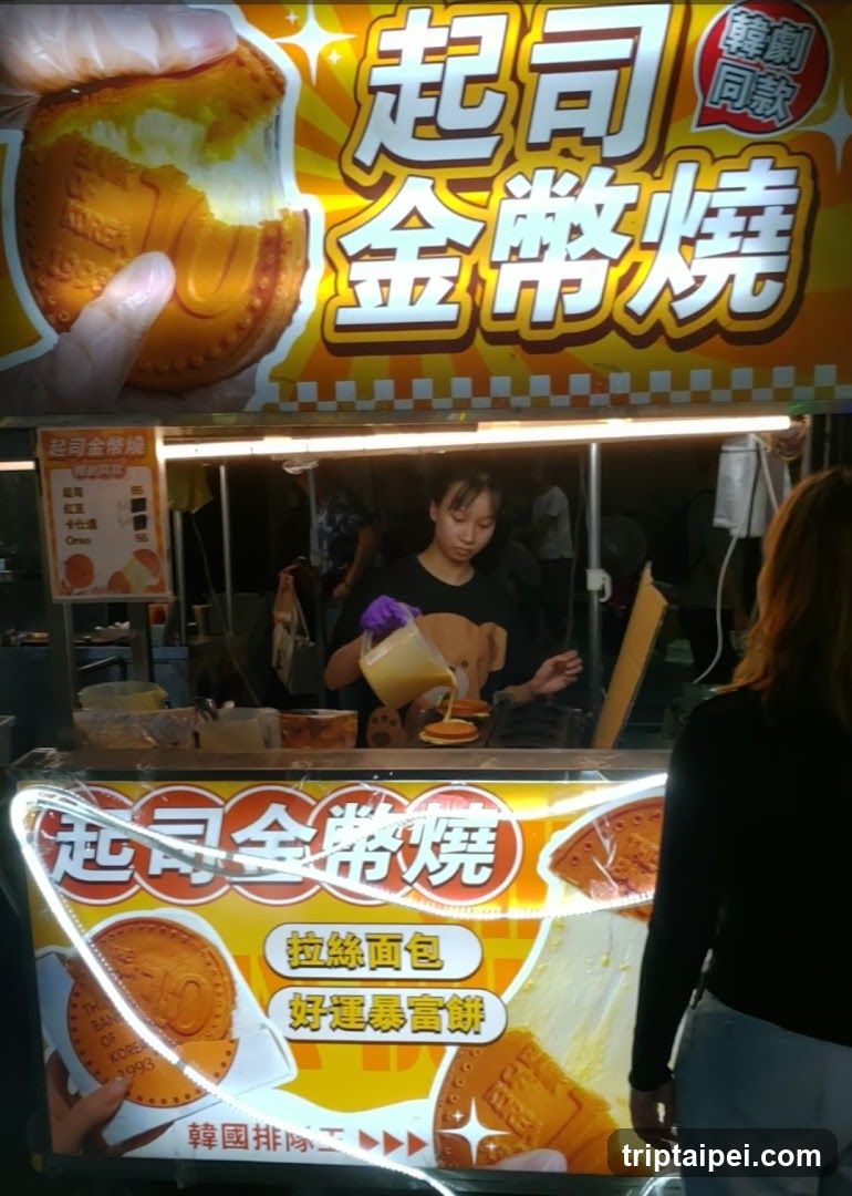 Stall with '起司金幣燒' signage and food display
