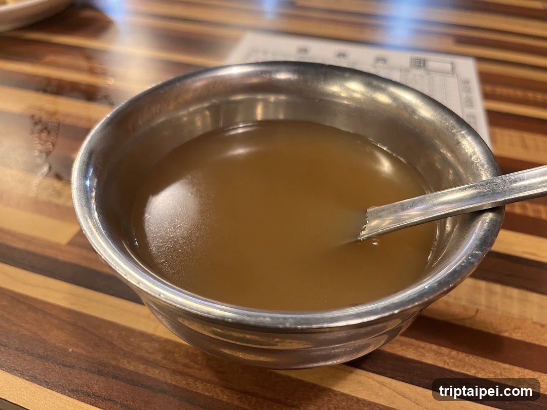 Bowl of Soup with Spoon