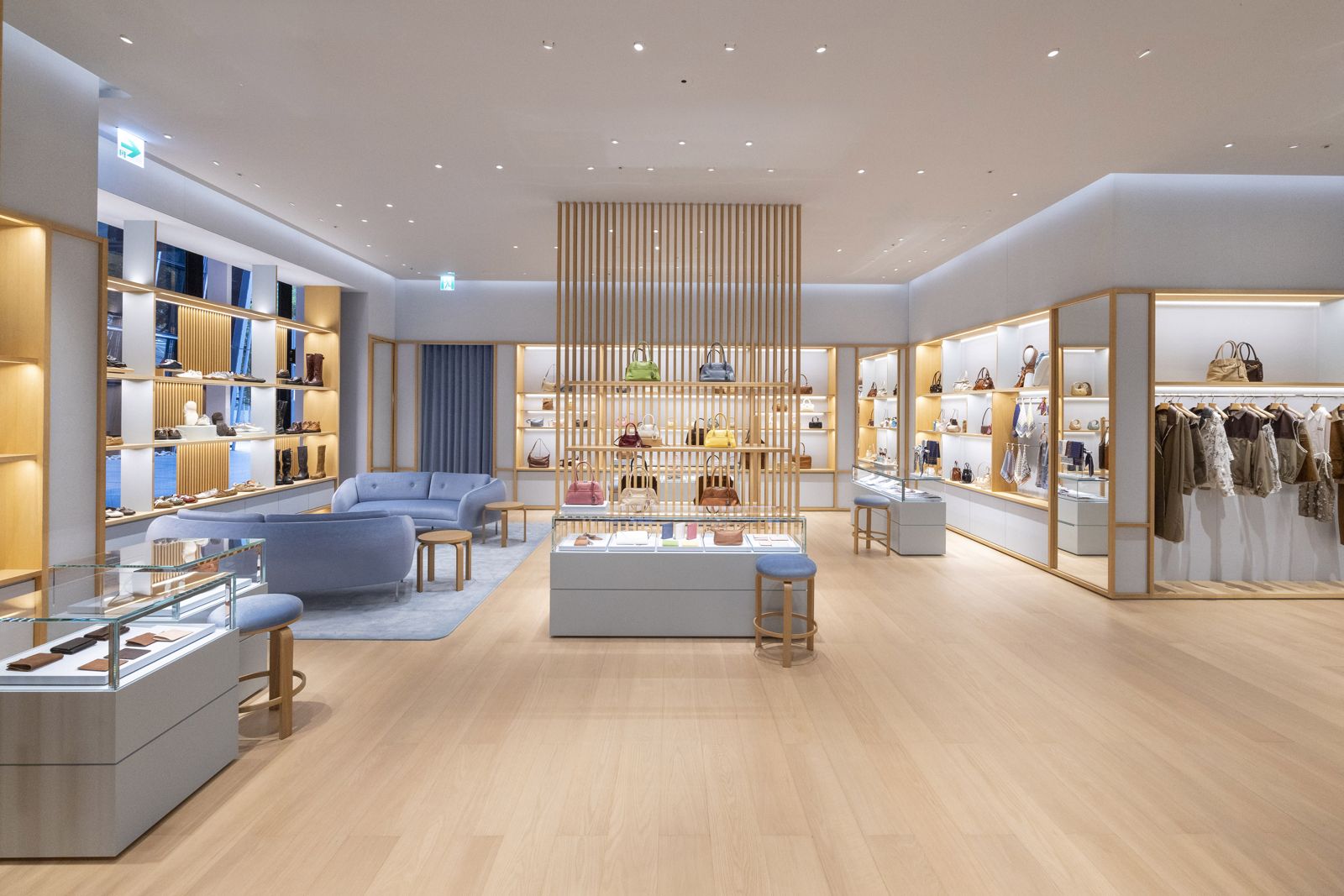 Miu Miu Breeze Nanshan interior with wood slats, oak floors and signature blue fittings