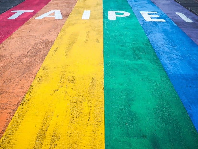 The Taipei rainbow pride flag painted on the street outside Ximen MRT exit 6